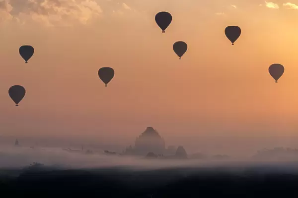 Bagan pagoda with hot air balloons in the morning