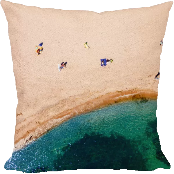 Top-down aerial view of sunbathers on a beach in Hanko, southern tip of Finland