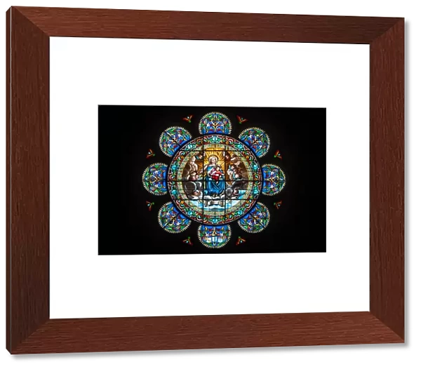 Stained Glass Rose Window featuring the Virgin Mary and her son Jesus Christ in the
