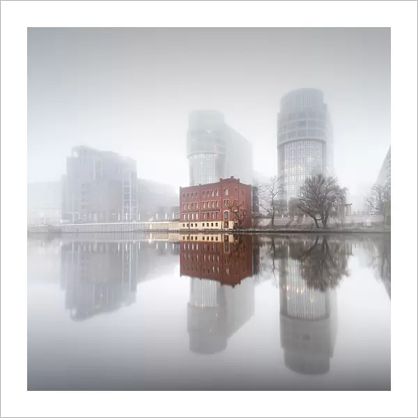 Minimalist long exposure of the former Ministry of the Interior on the Spree in thick morning fog in Moabit, Berlin, Germany, Europe