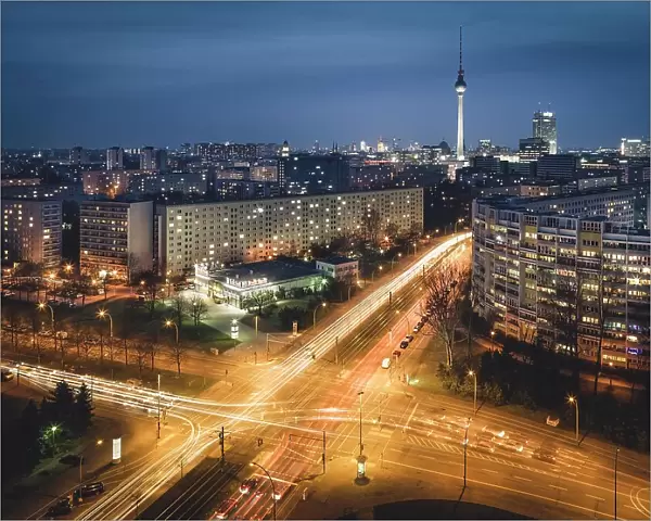 Traces of Light, Illuminated Crossing, Berlin Television Tower and Platz der Vereinten Nationen in the Evening, Berlin, Germany