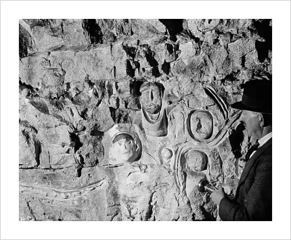Inside the Chislehurst caves showing the war time ( First World War ) carvings