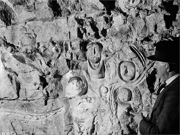Inside the Chislehurst caves showing the war time ( First World War ) carvings