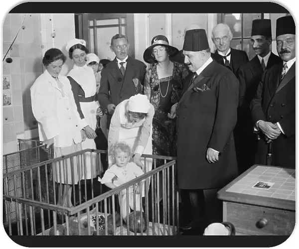 King Fuad at the Royal Free Hospital. A little patient who presented King Fuad with his doll