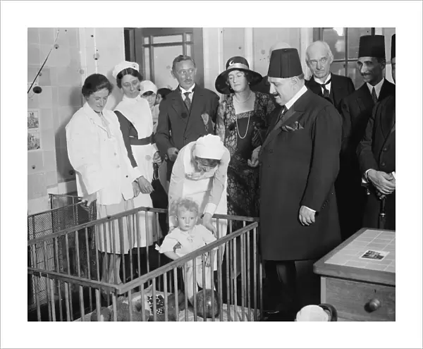 King Fuad at the Royal Free Hospital. A little patient who presented King Fuad with his doll