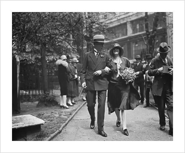 American author weds. Mr Sinclair Lewis and Miss D Thompson leaving the Savoy
