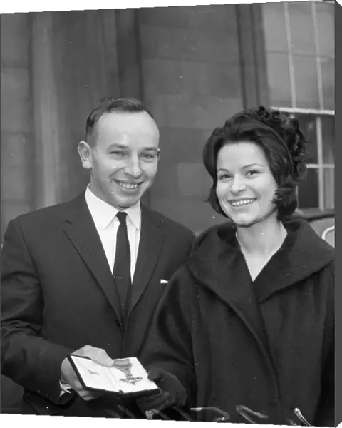 John Surtees with Miss Patricia Burke outside Buckingham Palace after he collected