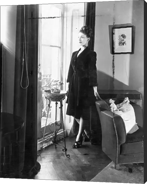Margot Fonteyn at home. Margot Fonteyn, looks out into Pelham Cresent from the french