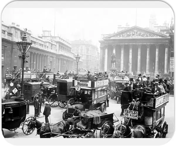 London scene. London traffic, mainly horse - drawn, making its way around the Royal Exchange