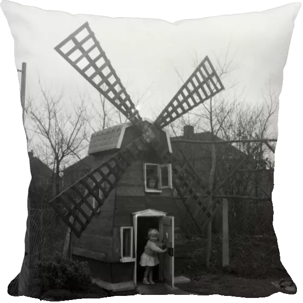 Five-year-old Denise Holmes and her sister Nicola, two, now have a windmill at