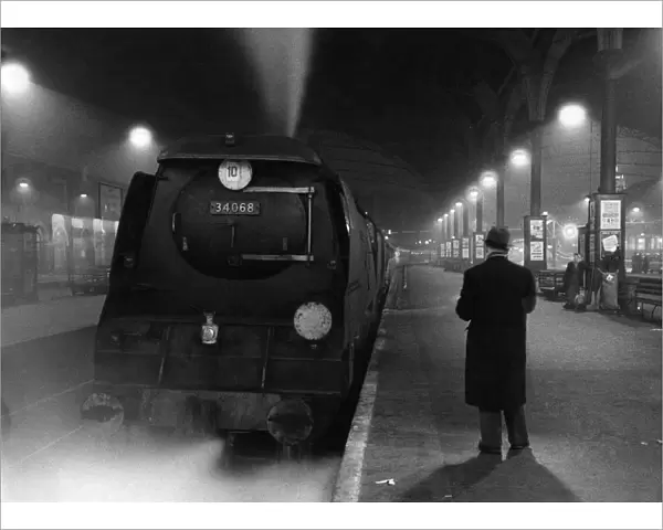 Railway station at night - 1959 Credit: TopFoto