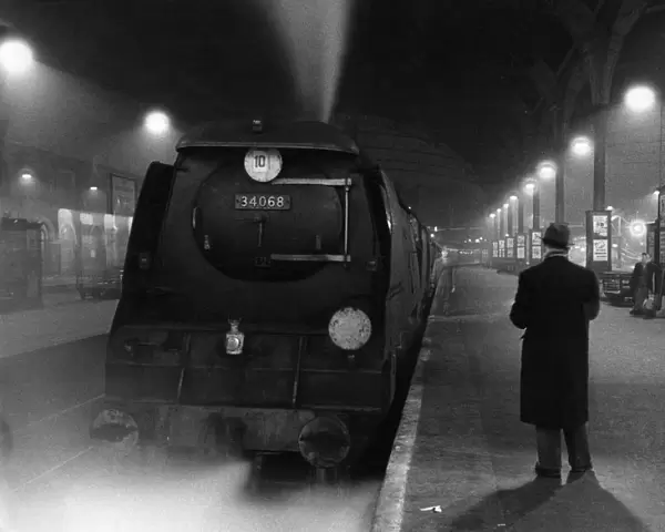Railway station at night - 1959 Credit: TopFoto