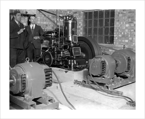 Generators at the Commodore Cinema, Orpington, Kent in the 1930s, with cinema staff looking