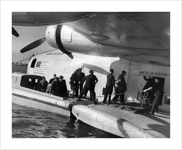 Passengers boarding a flying boat the Bermuda Sky Queen leaving Poole for America
