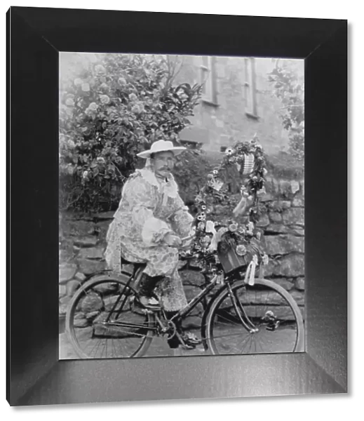 Samuel John Govier posed in fancy dress on his bicycle, locality unknown but somewhere in West Cornwall. Early 1900s