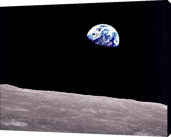 Rising Earth about five degrees above the lunar horizon