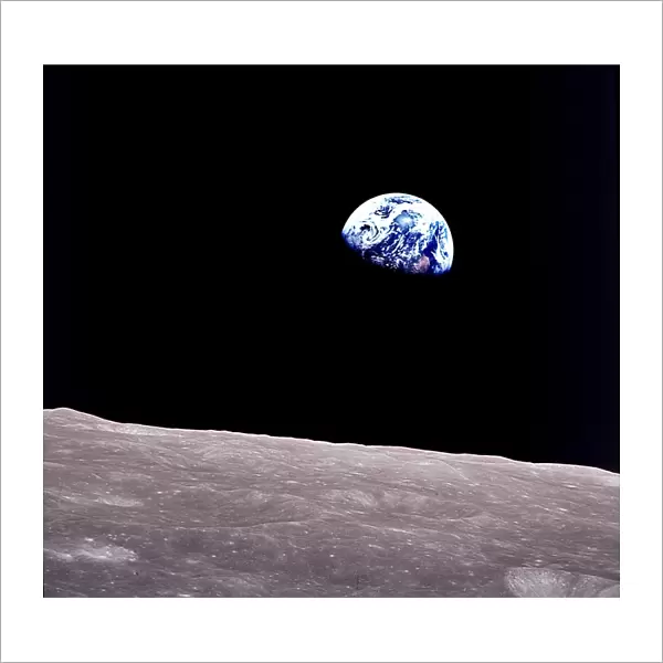 Rising Earth about five degrees above the lunar horizon