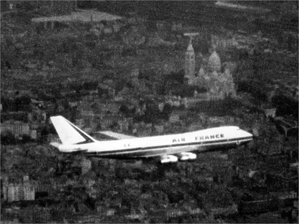 An Air France Boeing 747 make first flight over Paris, Montmartre and Basilica of the Sacre Coeur
