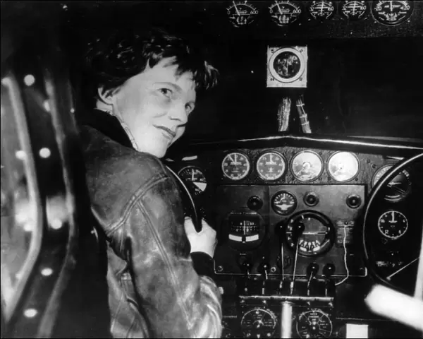 Amelia Earhart at the controls of her plane