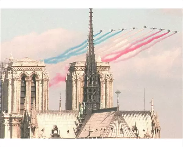 Alphajet planes of the Patrouille de France fly next to Notre Dame