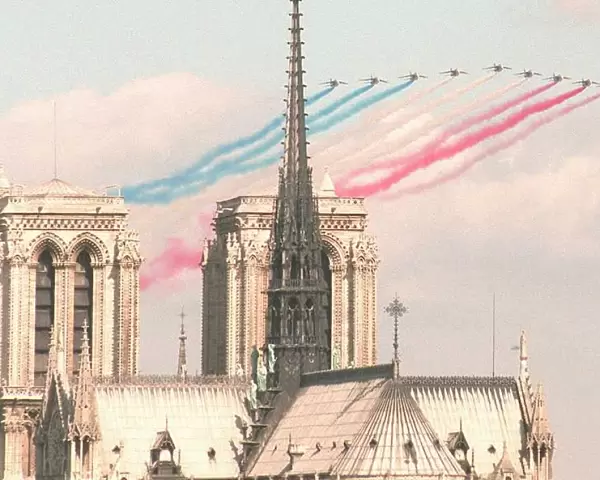 Alphajet planes of the Patrouille de France fly next to Notre Dame