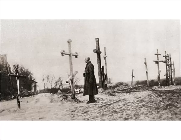 A Russian soldier at the grave of a comrade-in-arms during World War One, from The