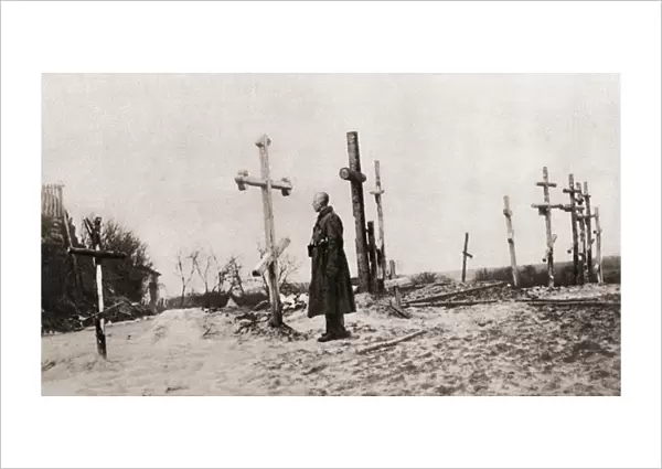 A Russian soldier at the grave of a comrade-in-arms during World War One, from The
