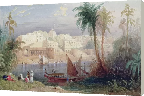 A View of an Indian city beside a river, with boats on the river and figures in the