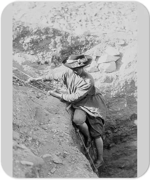 Hilda Petrie (nee Urlin) descending by rope ladder into a tomb shaft