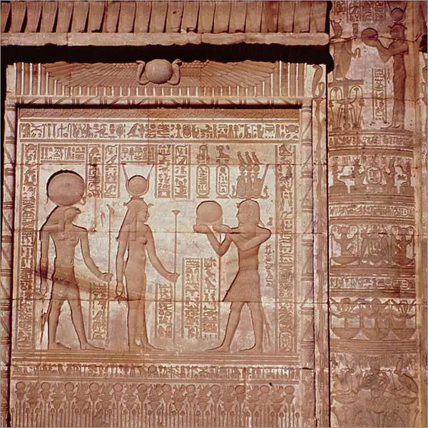 Relief depicting a pharaoh making an offering to Hathor and Horus