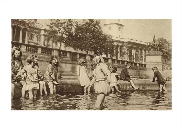 Children enjoying a paddle in Trafalgar Square during a heatwave (b  /  w photo)