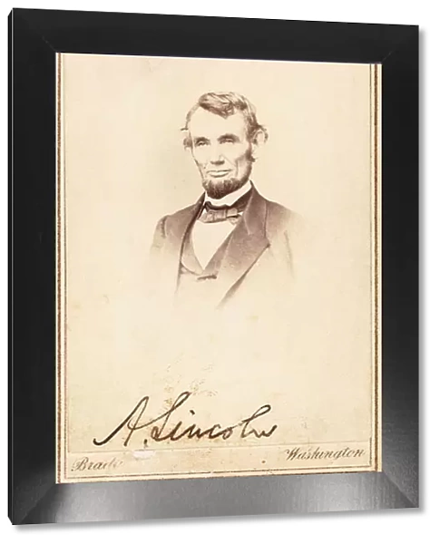 Abraham Lincoln, signed carte-de-visite, 1864 (vignette, mount, gold-ruled border, ink)