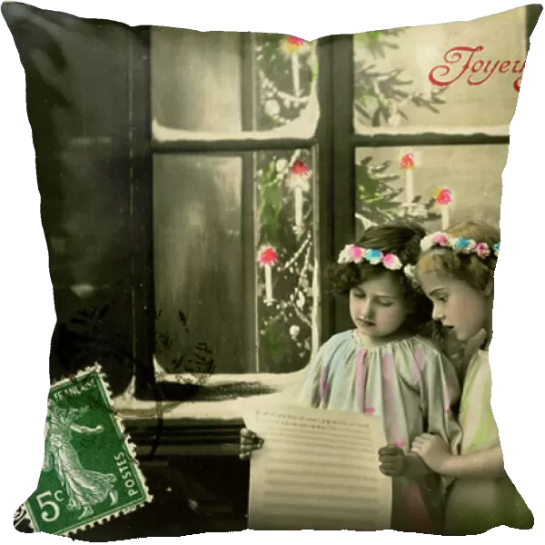 Postcard, Christmas greeting: Chant of two angels reading a score in front of a snow-covered window. The beginning of the 20th century