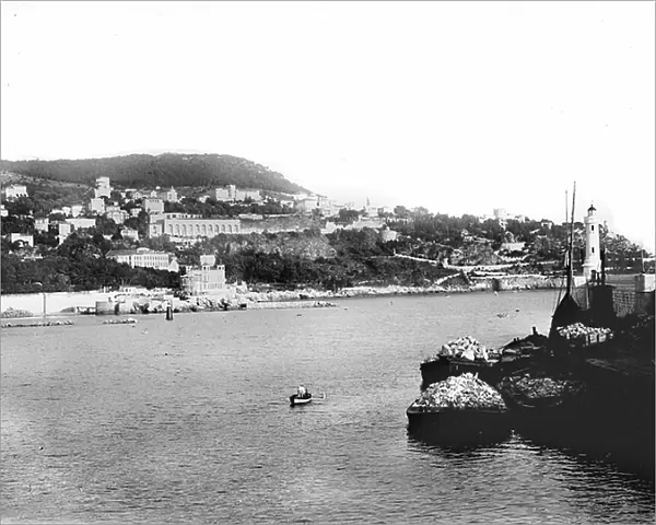Principaut of Monaco, Monte Carlo: casino, lighthouse, boats and barges filled with stone blocks, 1900