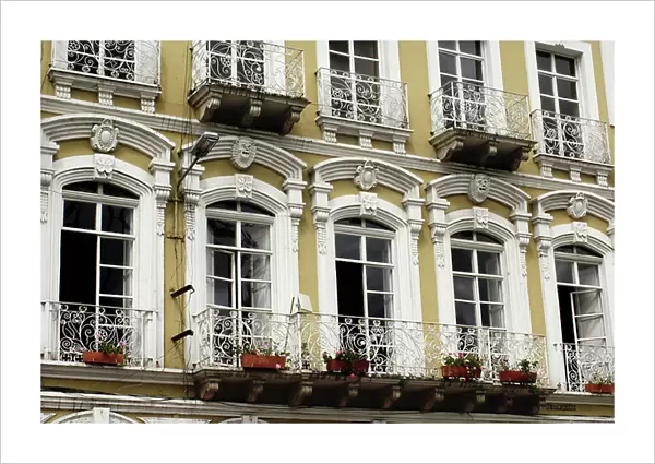 Architecture in Latin America: Windows and balconies of buildings from the Spanish colonial era of Cuenca, Ecuador city