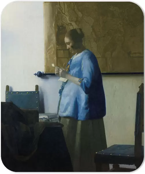 Woman Reading Letter young woman standing table