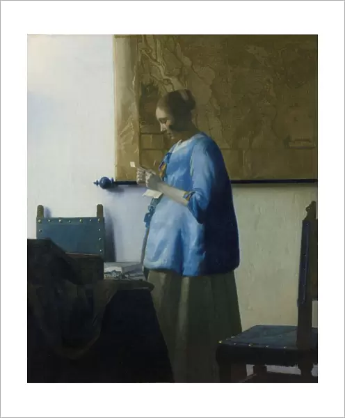 Woman Reading Letter young woman standing table