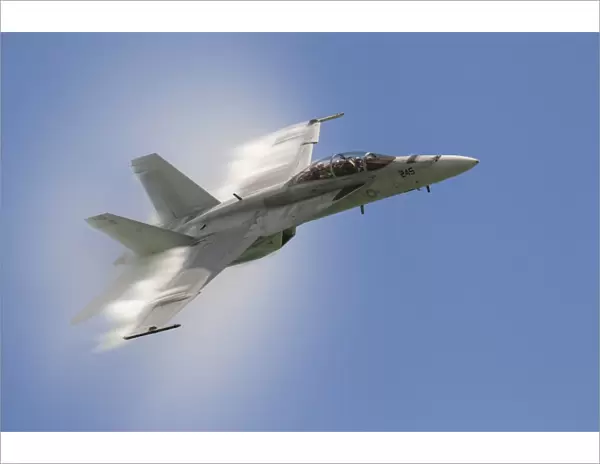 A U. S. Navy F  /  A-18F performs a fast pass over Chicago, Illinois