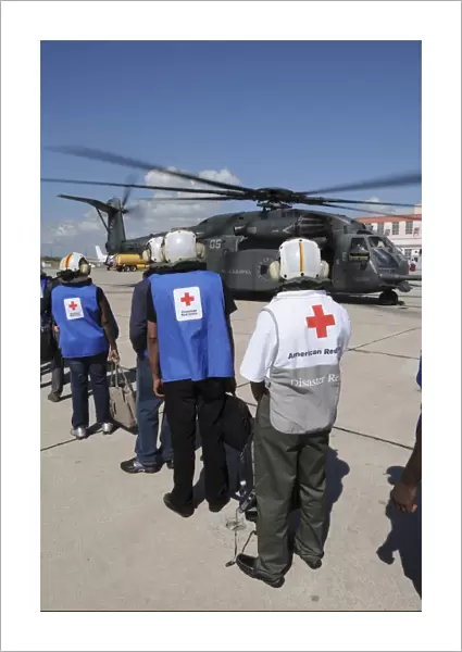 American Red Cross volunteers prepare to board a MH-53E Sea Dragon