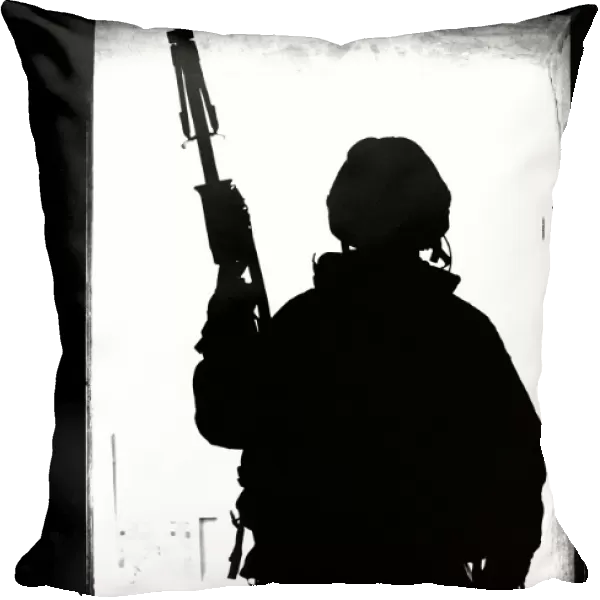 Silhouette of a British soldier in a doorway at Camp Condor, Iraq