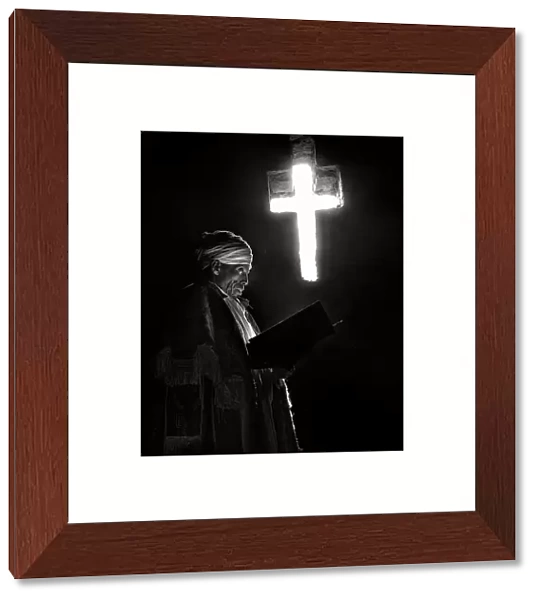 The priest, the book and the cross of light