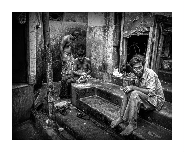 Three men in the streets of Kolkata (India)