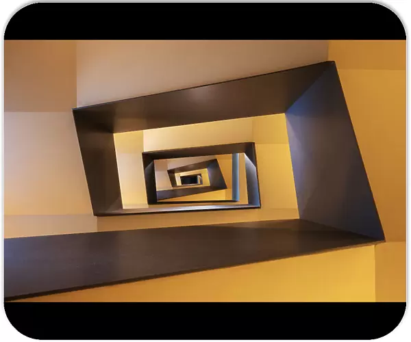 Several geometric forms in shades from yellow to brown of a staircase in Frankfurt