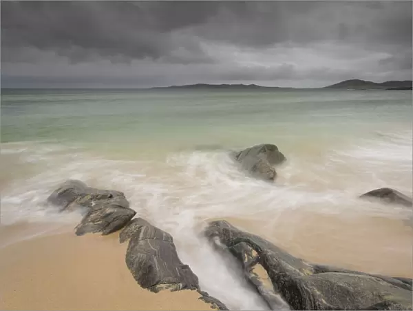 Rocks on Seilebost beach with storm approaching, North Harris, Outer Hebrides, Scotland