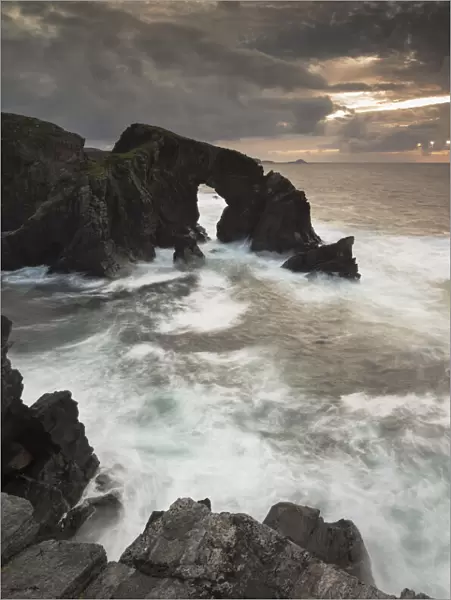 Rock archway at sunset, Isle of Lewis, Outer Hebrides, Scotland, UK, September 2014