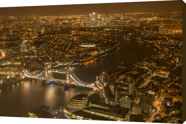 Aerial view of River Thames and Tower Bridge in London at night. October 2014