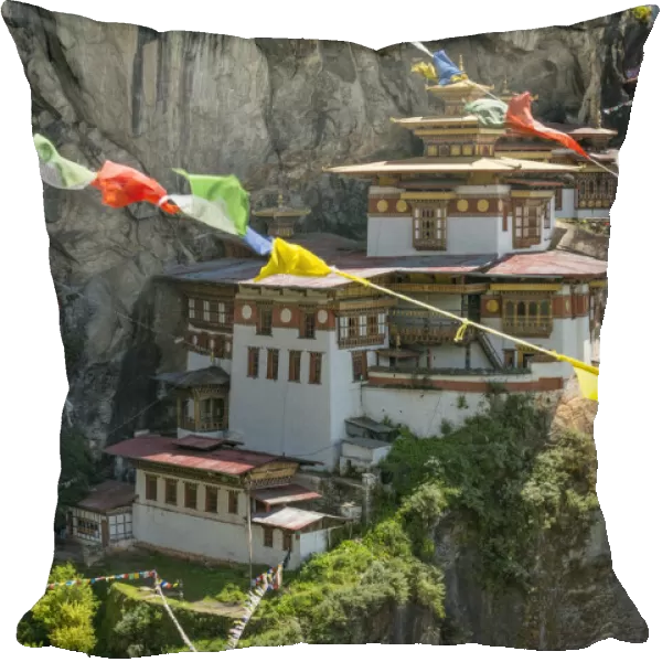 Paro Taktsang  /  Tigers Nest Buddhist monastery perched on cliffs with prayer flags