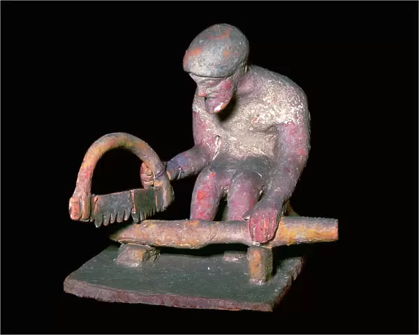Greek terracotta figure of a man sawing wood, 6th century BC
