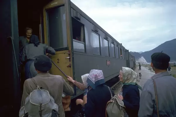 Local people boarding a train in Czechslovakia. Artist: CM Dixon