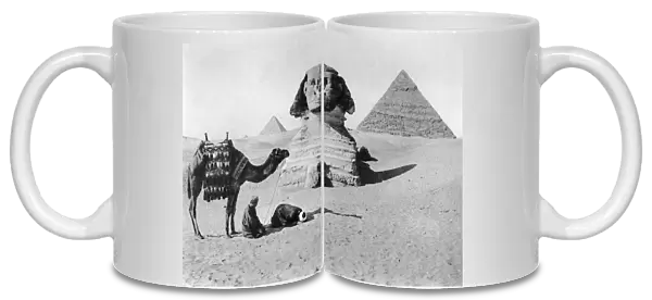 Praying before a sphinx, Cairo, Egypt, c1920s